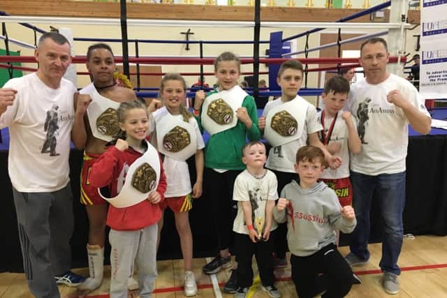 Assassins show off their British titles.
