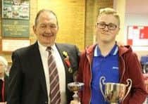 Brandon Gilblett collects his under 18 trophy.