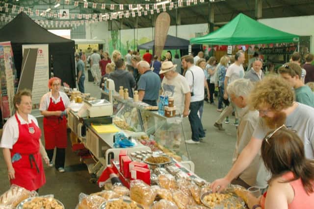 Crowds at Melton Cattle Market sample a tempting variety of pies, pastries and bread PHOTO: Tim Williams
