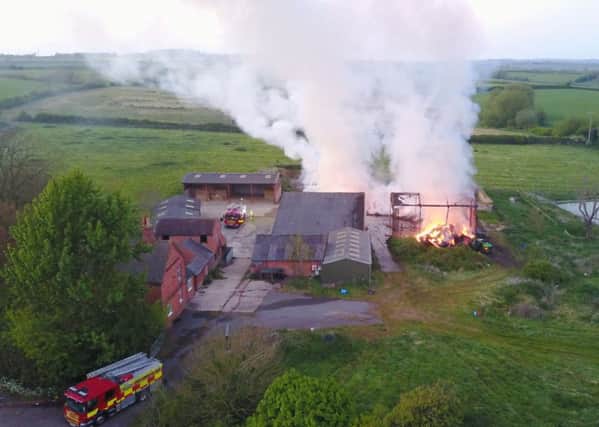 Firefighters tackle a blaze at a barn which contained 200 bales of hay, in Nottingham Road, Melton.
PHOTO Mark from aerialview360 EMN-171005-132702001