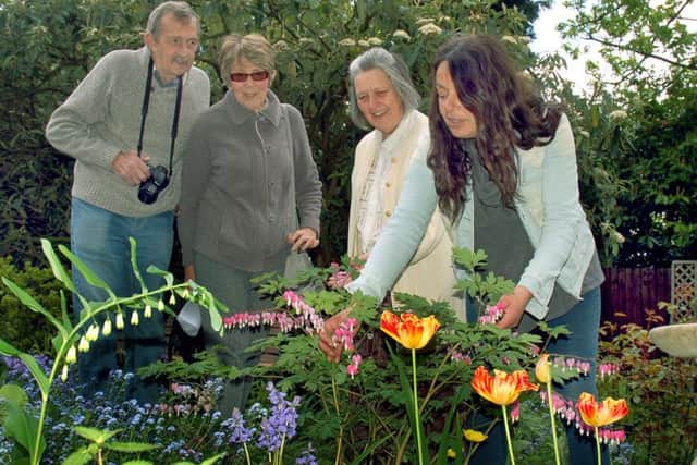 Owner Alison Blythe shows Alan and Carole Hewitt around the flower beds with horticultural expert Christina Moulton PHOTO: Tim Williams