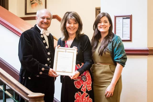 High Sheriff Professor Surinder Sharmer presents the award to Eluned Owen, pastor of Melton Vineyard Church (left) and Caroline Webb, Storehouse coordinator PHOTO: Gary Summers