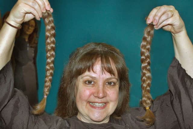 Brooksby Melton College hairdressing tutor Jo Sloan, who survived cancer, has her hair cut off for charity EMN-171205-121824001