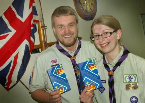 Tom Hazeldine and Rebecca Watts, who are Cub Scout Leaders in the 4th Melton Mowbray Darwin Cubs, show off their Queens Scout Awards, the highest achievable youth award in Scouting EMN-170516-102612001