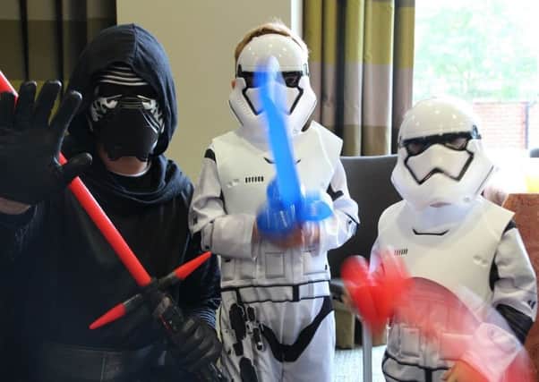 Youngsters practise some light saber skills PHOTO: Supplied