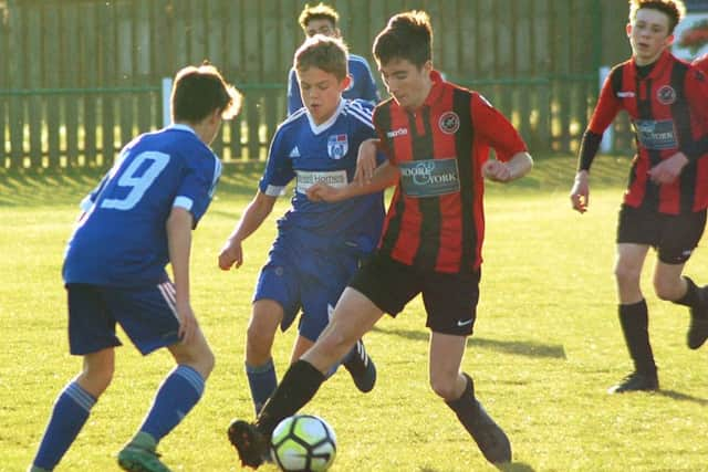 Melton Charity Cup final action EMN-170516-180208002