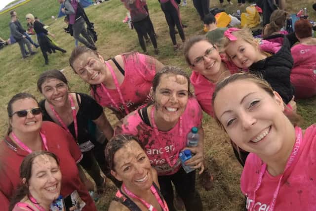 Covered in mud: Little Stars staff at the finish line of the Race for Life course at Prestwold Hall PHOTO: Supplied