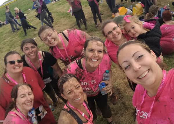 Covered in mud: Little Stars staff at the finish line of the Race for Life course at Prestwold Hall PHOTO: Supplied