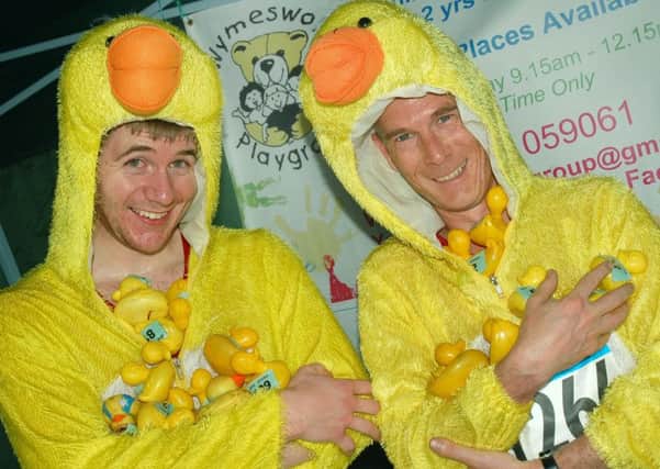 Josh Taylor and Steve Owen at the duck raffle stall raising money for Wymeswold Playgroup PHOTO: Tim Williams