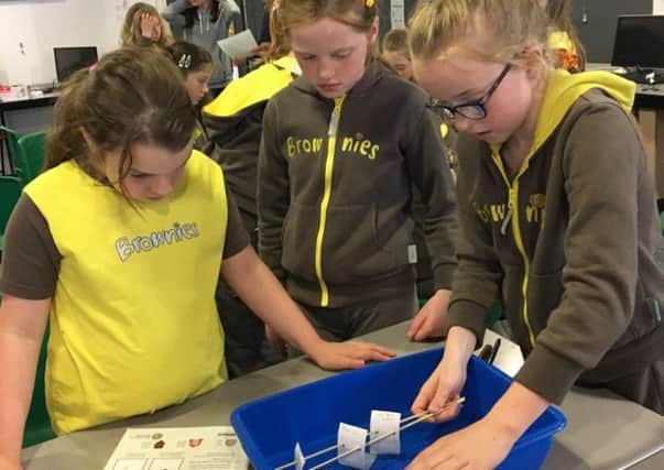 Girls from the 1st Thrussington Brownies get the chance to do their own science experiments PHOTO: Supplied