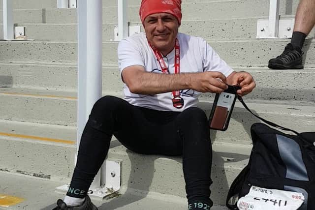 Richard taking a well earned rest at the finish line in Brighton PHOTO: Supplied