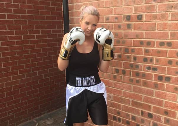 Amateur Asfordby boxer Cindy pictured in her sports gear she wore for her charity bout in Nottingham PHOTO: Supplied