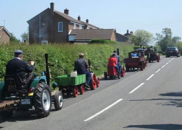 Three traction engines, a steam lorry and a miniature Field Marshall tractor set off from the sports field on a parade through the village PHOTO: Supplied