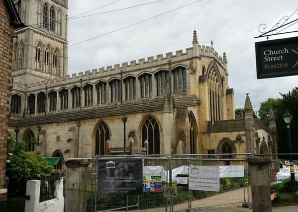 The fenced off area around St Mary's Church in Melton where major renovation work is going on until November EMN-170530-182524001