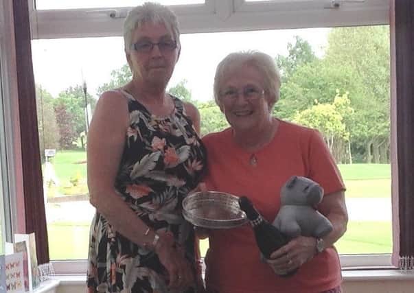 Chris Cook (left) with Lady Presidents Day overall winner, Kathie Finn. EMN-170530-165601002