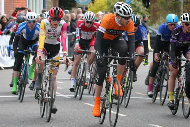 Old Dalby George Sewell (orange top) riding in last year's Junior CiCLE Classic for Wymondham-based Windmill Wheels EMN-170531-104042002