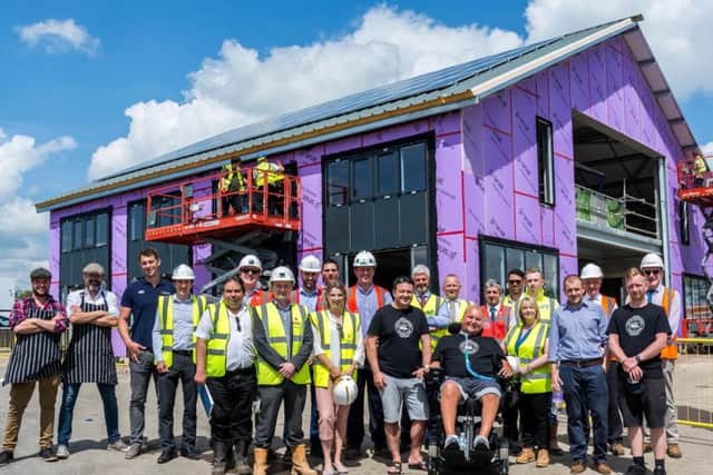 Project partners gather as internal works begin on the Matt Hampson Foundation's Get Busy Living Centre at Burrough on the Hill EMN-170531-165901001