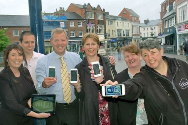 Melton Bid directors and managers Siobhan Lane, Mark Cook, Andrew Cooper, Shelagh Core, Julie Swain and Sarah Browne celebrate the launch of free wifi in the town EMN-170506-150604001