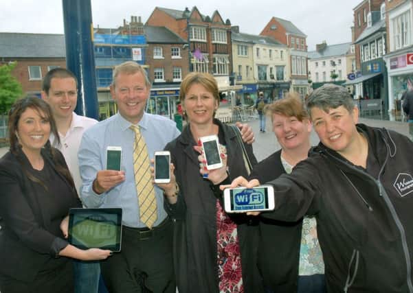 Melton Bid directors and managers Siobhan Lane, Mark Cook, Andrew Cooper, Shelagh Core, Julie Swain and Sarah Browne celebrate the launch of free wifi in the town EMN-170506-150604001