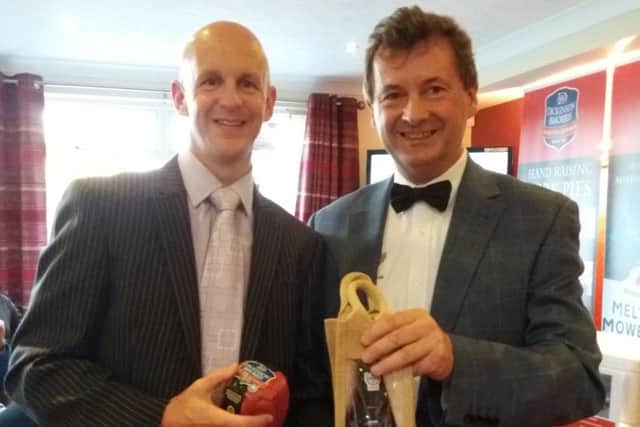 Craig Hallam, who shot a hole-in-one on the 14th, with Dickinson and Morris MD Stephen Hallam EMN-170606-162405002