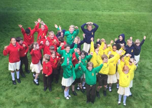St Francis Catholic Primary School's pupils' celebrate after the school received a 'good' Ofsted rating PHOTO: Supplied