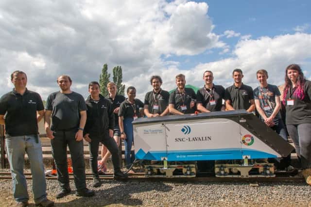 The 2016 winners SNC-Lavalin's Rail and Transit team pictured alongside their innovative locomotive engine PHOTO: David Shirres