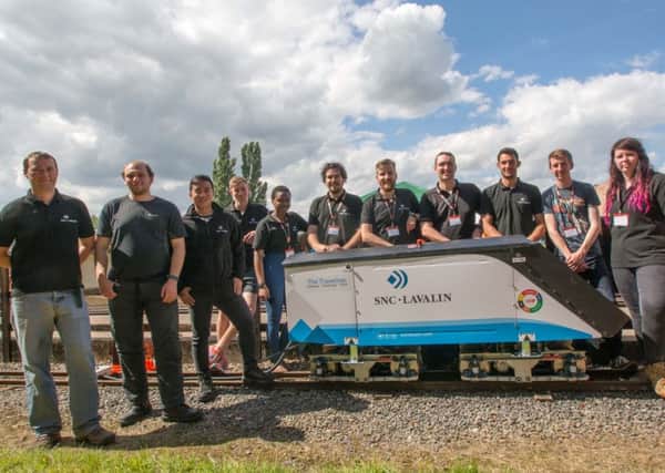 The 2016 winners SNC-Lavalin's Rail and Transit team pictured alongside their innovative locomotive engine PHOTO: David Shirres