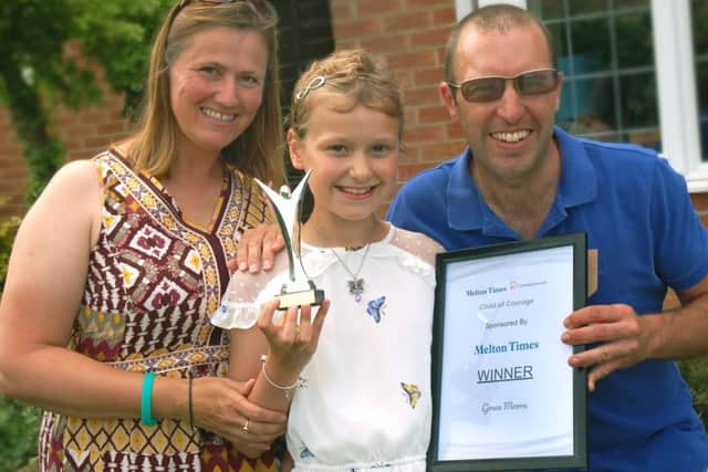 Grace Moore with mum Trish and dad Ben.