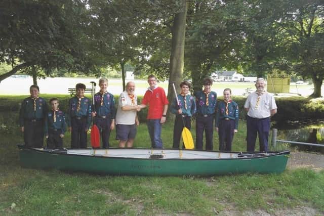 The Melton Mowbray 4th Scout Group with a canoe from last year's race PHOTO: Supplied