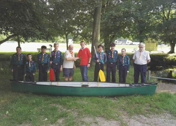The Melton Mowbray 4th Scout Group with a canoe from last year's race PHOTO: Supplied