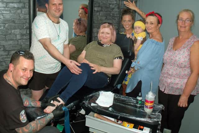 Tattooist and shop owner Chris Greaves with Egerton Lodge staff who had Manchester Bee tattoos done at the Cre8tive Ink studio in Melton to raise money for the appeal following the recent terrorist bombing EMN-170626-125242001