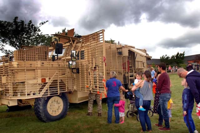 Lots of interest in some of the armoured vehicles on display at the Defence Animal Centre open day EMN-170626-173908001