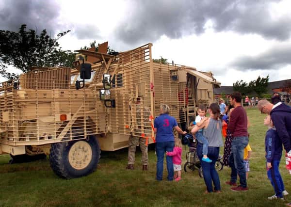 Lots of interest in some of the armoured vehicles on display at the Defence Animal Centre open day EMN-170626-173908001