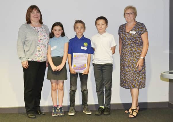 Pupils and staff at The Grove Primary School, Melton, receive an anti-bullying award at a ceremony at the National Space Centre in Leicester EMN-170628-111627001