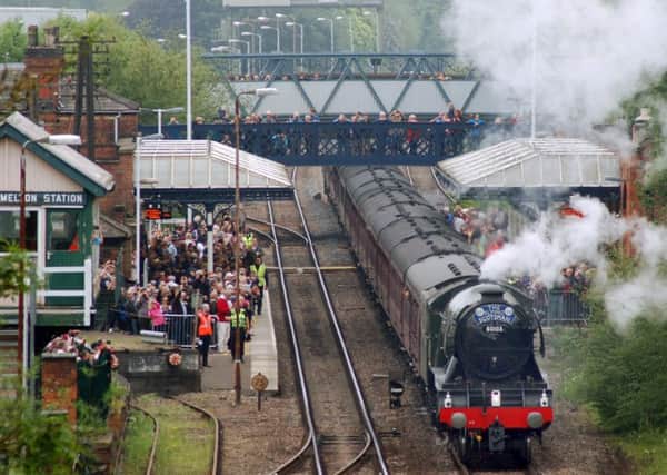 The Flying Scotsman, pictured here from the Dalby Road bridge on a recent visit, is set to pass through Melton Station again on Saturday 
PHOTO: Tim Williams EMN-170628-101931001