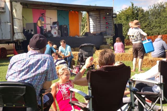 The Hose Fest crowd enjoy the music and evening sunshine PHOTO: Tim Williams