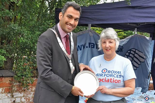 Melton Mayor, councillor Tejpal Bains presents Brenda Cox with this year's Robert Hyslop Citizen of the Year Award for long service and dedication to the RAFA Melton Mowbray Branch PHOTO: Supplied