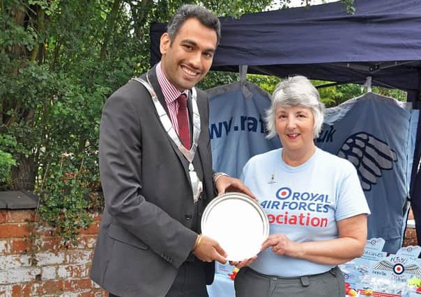 Melton Mayor, councillor Tejpal Bains presents Brenda Cox with this year's Robert Hyslop Citizen of the Year Award for long service and dedication to the RAFA Melton Mowbray Branch PHOTO: Supplied