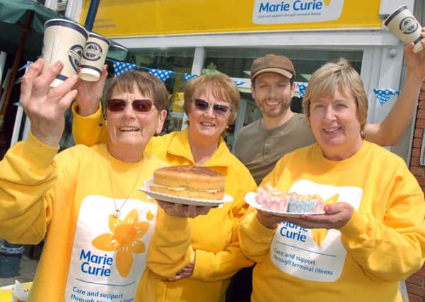 Marie Curie volunteers Cathy Lawrence, Eunice Titmuss and Michele Jones with Mark Cook from More Coffee Co PHOTO: Tim Williams