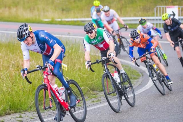 Simon Price drives a break on his way to gold in the men's C2 road race. EMN-170507-112825002