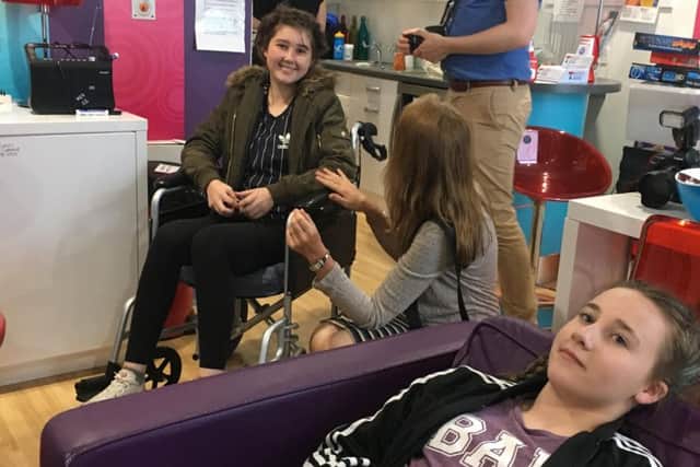 Jessica Edwards, an Asfordby teenager who has been treated for cancer at Ward 27, with her sister Isabelle in the unit's 'Chill Out Room' EMN-170607-164725001