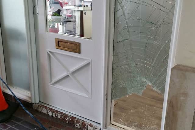 The smashed window where burglars forced entry into the JN Nails business in the Bell Centre in Melton EMN-171007-151532001