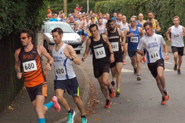 Race winner Phil Martin (680) and Jason Barton (620) get out in front as the race heads out of Whissendine EMN-171107-175821002