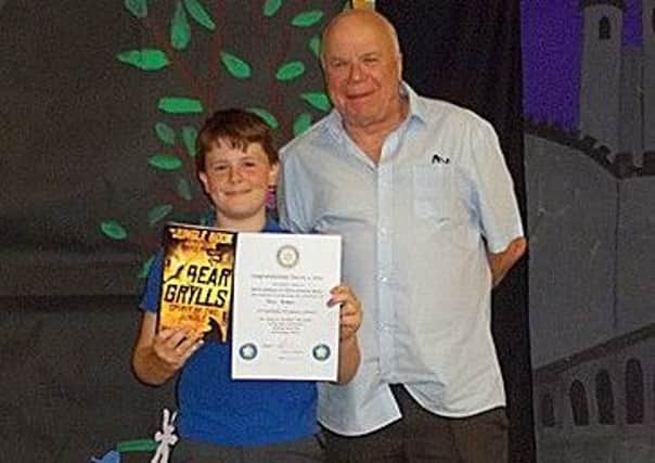 Max Green of Ab Kettleby Primary School with his award from Rotarian Tony Pick PHOTO: Supplied