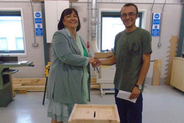 Karen Riley from the Skills Funding Agency with Brooksby Melton College joinery apprentice Sam Coxon PHOTO: Supplied