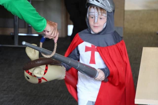 A young knight perfects his jousting on a hobby horse PHOTO: Tony Rous