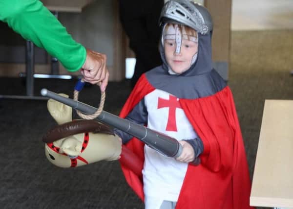 A young knight perfects his jousting on a hobby horse PHOTO: Tony Rous