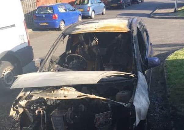 A burned out car which was set alight in Harlech Walk during a second wave of arson attacks on the Fairmead Estate EMN-171207-100833001