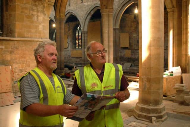 Project coordinator Ian Neale checks the plans with site manager Derek Monahan as work continues on a Â£1.9 million Re-Ordering Project at St Mary's Church, Melton EMN-170718-120222001