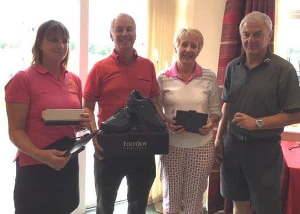 Melton Golf Club mixed open winners, from left, Sandie Normanton, Haydn Snow and Liz Snow with club chairman Phil Millward. EMN-170719-104317002